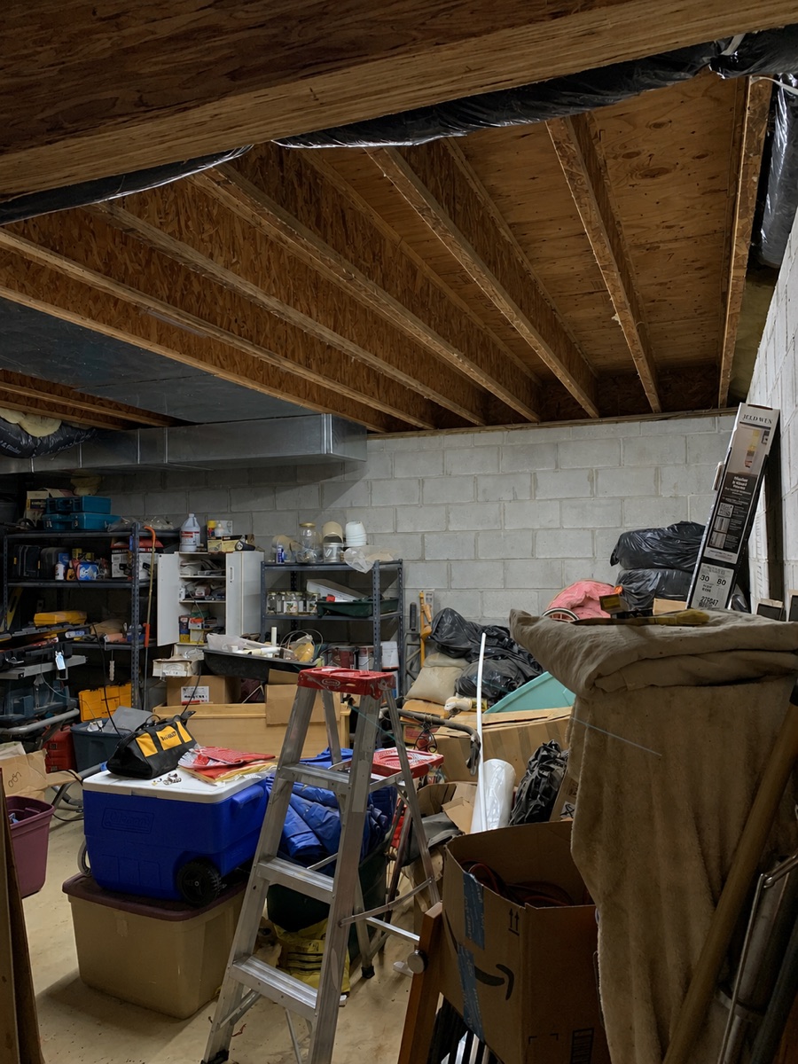 Unfinished basement with concrete block walls